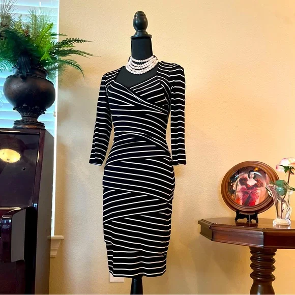 Black House/White Market. Tiered Horizontal Stripe dress. Size 4. Hugs perfectly Black House/White Market. Tiered Horizontal Stripe dress. Size 4. Hugs perfectly